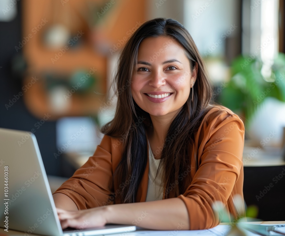 Woman is sitting at a desk with a laptop in front of her Woman is sitting at a desk with a laptop in front of her