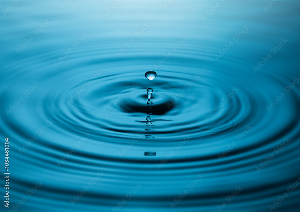 Blue Water drop falling, macro splash. Natural background Blue Water drop falling, macro splash. Natural background