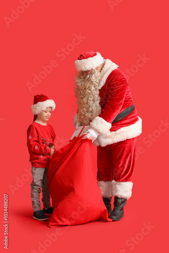 Santa Claus and cute little...