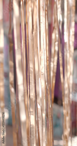 closeup view reflective metallic strands elegantly showcasing intricate texture play of light movement of highlights and background stripes in dynamics, readiness for performance