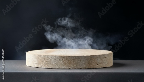 light grey and beige stone podium on dark background with smoke