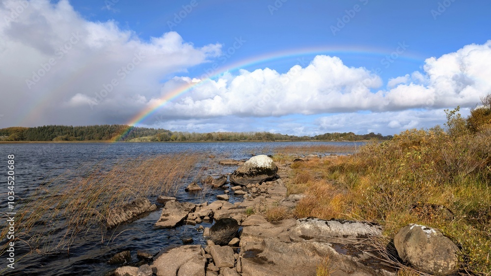 Beautiful lakeside landscape scenery, Rainbow over Ross lake at Rosscahill, Galway, Ireland, nature background