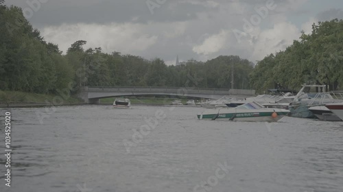 ST. PETERSBURG, RUSSIA -JUNE 17, 2023: Young women ride on a luxury motor boat along the canal of the Neva River