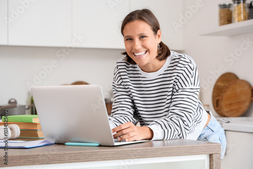 Teenage girl with laptop fi...