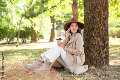 Young woman in brown hat an...