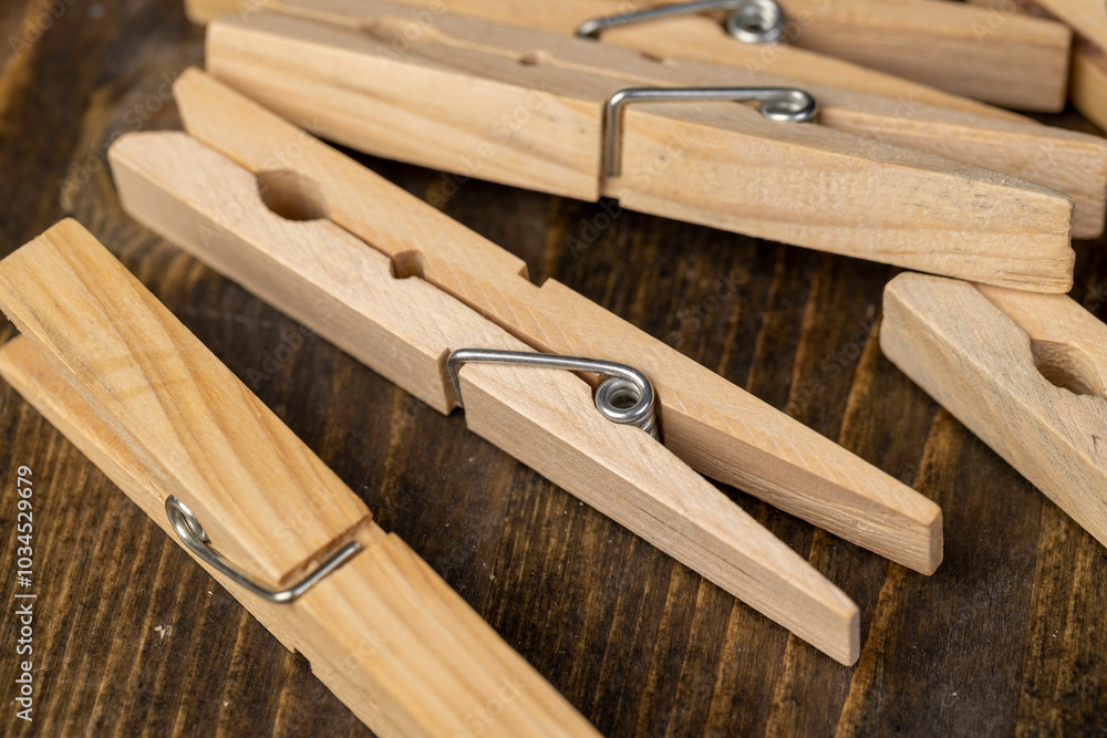 a group of wooden clothespins for drying clothes a group of wooden clothespins for drying clothes