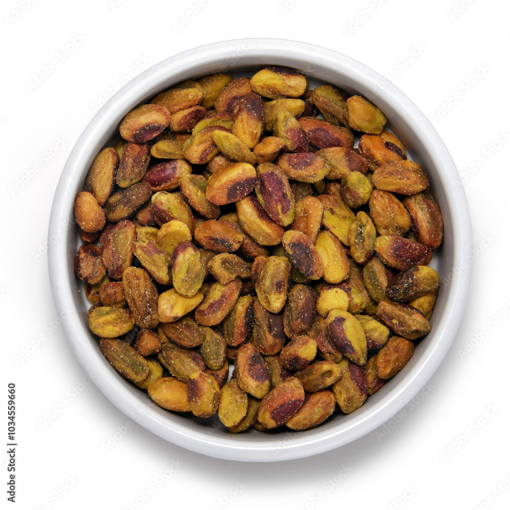 Pistachio nuts in round container Pistachio nuts in round container