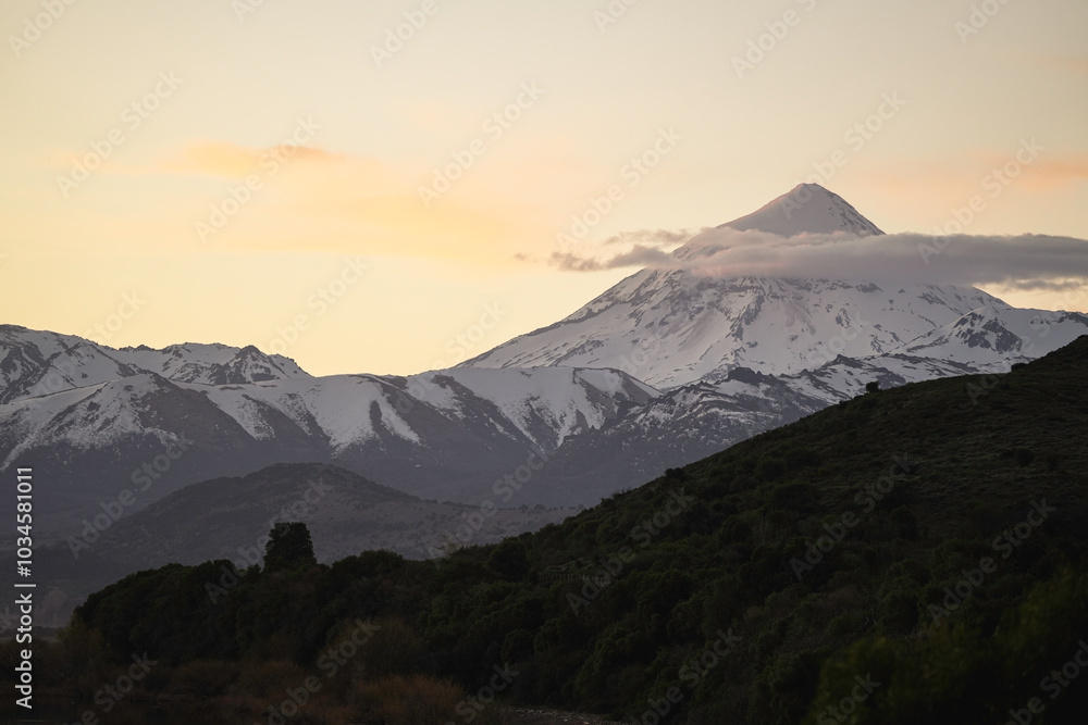 Epic snowy peak close up shot of volcano at sunset Epic snowy peak close up shot of volcano at sunset
