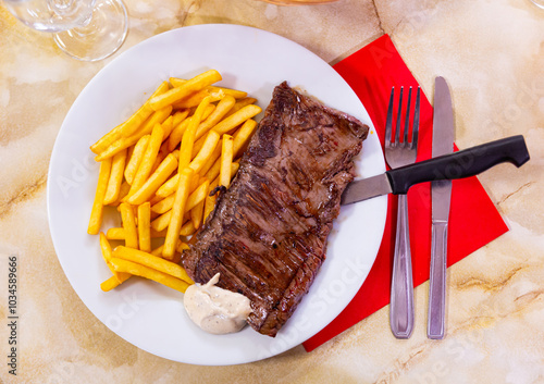 Entranya skirt steak, grilled beef with potatoes and sause photo