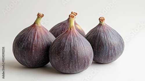 Fresh, ripe figs arranged on a wooden surface with an empty space for text, highlighting their natural beauty. A symbol of abundance, fertility, and Mediterranean culture, ideal for food-related conte