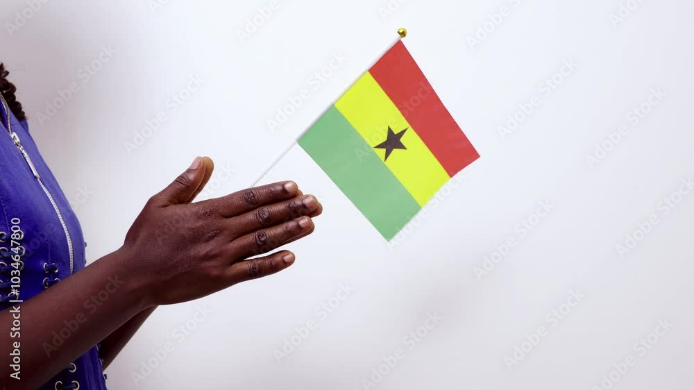 Black african female woman lady hand holding waving Ghanaian national flag praying against white background, Pray for Ghana concept Black african female woman lady hand holding waving Ghanaian national flag praying against white background, Pray for Ghana concept