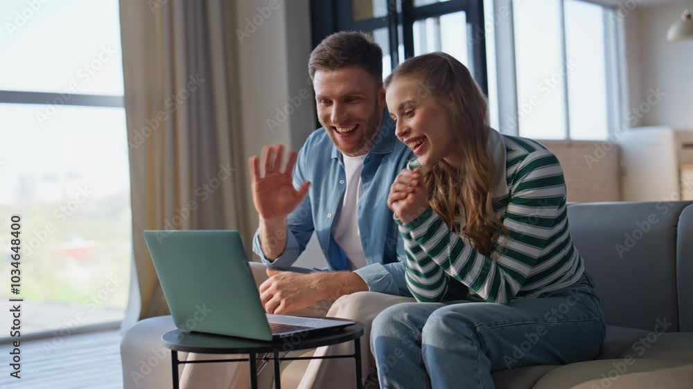 Laughing friends talking virtual meeting by laptop relaxing at apartment closeup Laughing friends talking virtual meeting by laptop relaxing at apartment closeup