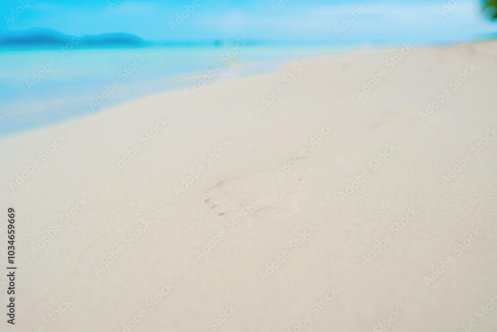 Empty beach, footprints on sand Empty beach, footprints on sand
