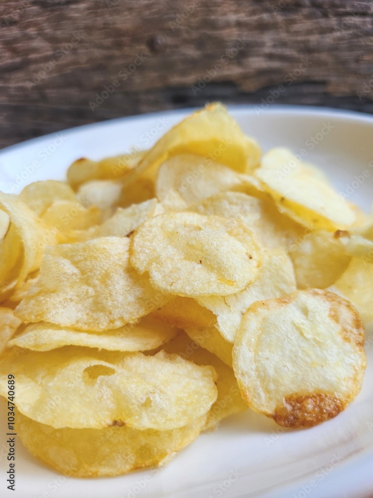 Potato chips on the plate Potato chips on the plate
