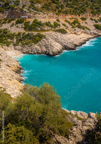 Small and savage beach on a rocky coast of the sea.