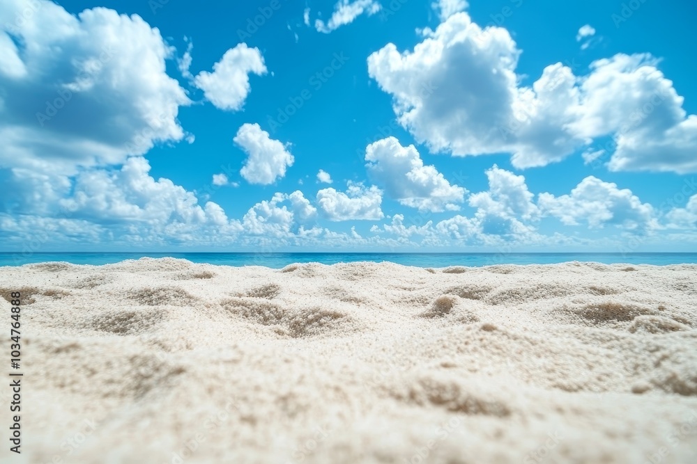 A close-up shot of pristine white sand on a tropical beach with a clear blue sky and white clouds in the background. A close-up shot of pristine white sand on a tropical beach with a clear blue sky and white clouds in the background.