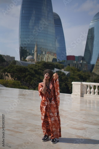 model with background of Baku flame tower photo