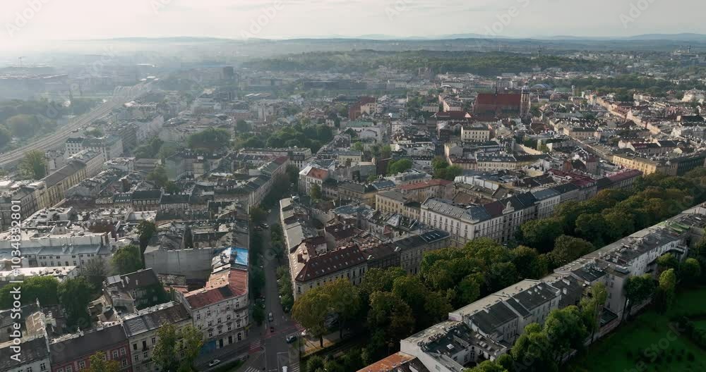 Aerial above Kazimierz, historic district of Cracow and old square, Poland. Early morning light with fog above the city Aerial above Kazimierz, historic district of Cracow and old square, Poland. Early morning light with fog above the city