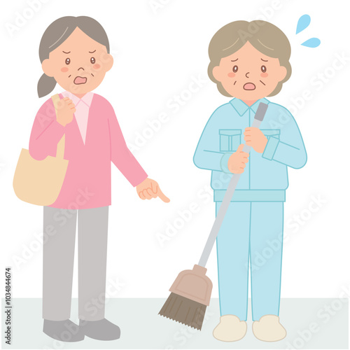 クレームを入れるシニア女性と清掃スタッフ