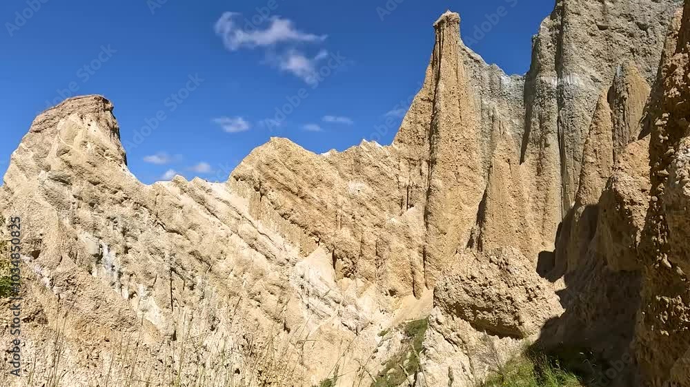 Omarama Clay Cliffs unique landscape with pinnacles, deep ravines, and sharp ridges formed by natural erosion, Waitaki Valley, New Zealand Omarama Clay Cliffs unique landscape with pinnacles, deep ravines, and sharp ridges formed by natural erosion, Waitaki Valley, New Zealand
