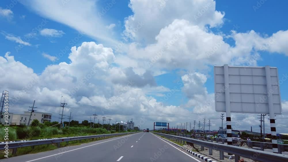 Driving through a motorway with heavy cloud in blue sky. Mesmerising scenic beauty. Mosque by the road. HD Driving through a motorway with heavy cloud in blue sky. Mesmerising scenic beauty. Mosque by the road. HD