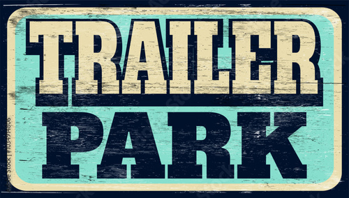 Aged retro trailer park sign on wood