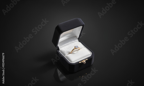 Blank black box with gold diamond ring mockup, dark background. photo