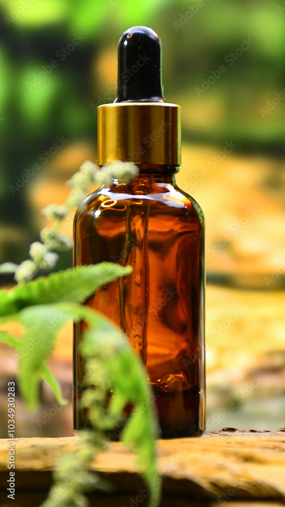 aromatherapy bottle with oil for homeopathic medicine or herbal medicine. Massage Oils. Natural cosmetics, skin care product in brown glass bottle on wood. Bottle with floral essential oil, close up aromatherapy bottle with oil for homeopathic medicine or herbal medicine. Massage Oils. Natural cosmetics, skin care product in brown glass bottle on wood. Bottle with floral essential oil, close up