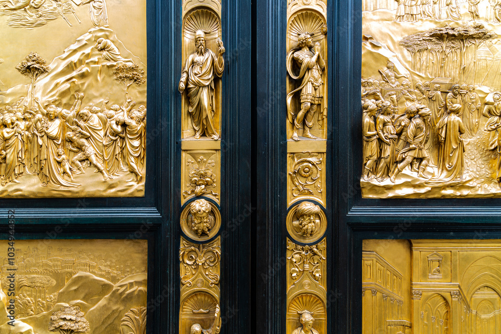 Golden door of baptistery near big cathedral in Florence