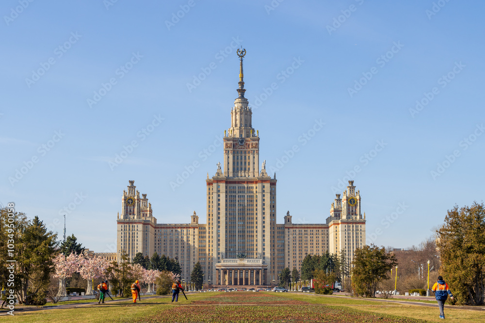 View of the main building of Moscow State University. A beautiful high-rise building with a spire. Architectural dominant and landmark of Moscow. Vorobyovy Gory, Moscow, Russia. View of the main building of Moscow State University. A beautiful high-rise building with a spire. Architectural dominant and landmark of Moscow. Vorobyovy Gory, Moscow, Russia.