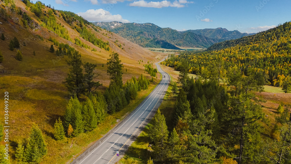 the car is driving along the Chuisky highway in Altai in autumn the car is driving along the Chuisky highway in Altai in autumn