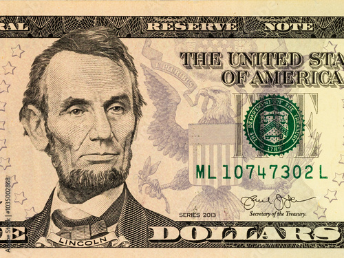 Close-Up Abraham Lincoln Portrait On US Five Dollar Bill photo