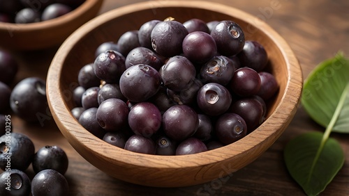 Wallpaper Mural A close-up of nutrient-rich Brazilian açaí berries in a rustic wooden bowl, showcasing their deep purple hue and superfood status. Torontodigital.ca