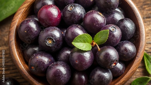 Wallpaper Mural A close-up of nutrient-rich Brazilian açaí berries in a rustic wooden bowl, showcasing their deep purple hue and superfood status. Torontodigital.ca