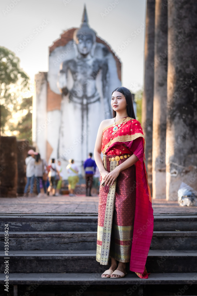 Portrait Beautiful asian woman in Thai traditional Thai dress costume in front of Pagoda temple at the ancient city Thailand,Loy Krathong Festival,At the Thai temple fair at night Portrait Beautiful asian woman in Thai traditional Thai dress costume in front of Pagoda temple at the ancient city Thailand,Loy Krathong Festival,At the Thai temple fair at night