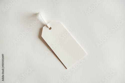 White clothing hang tag mockup blank paper cardboard price label tag with rope with sopy space photo