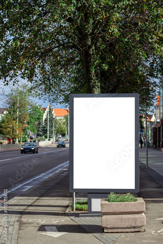 Vertical blank white street billboard in the city. Advertising banner with copy space. Mock up. Space for text