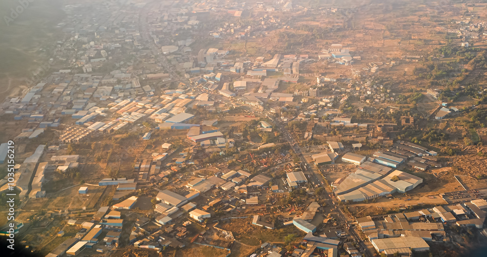Shil Phata - Mahape Rd, MIDC Industrial Area, Mahape, Navi Mumbai, Maharashtra, India. Mumbai Metropolitan Region. Aerial View From Airplane Window On View of the Mumbai suburb district. Evening