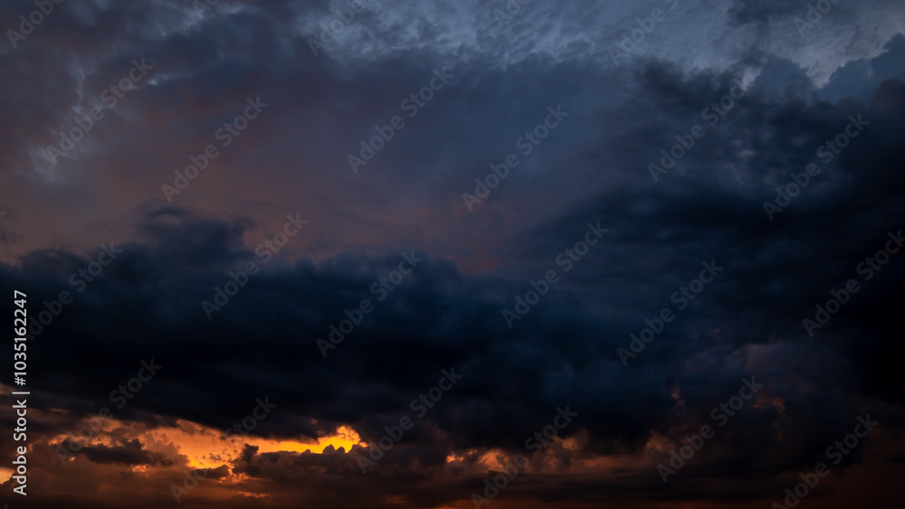 Dark sky with stormy clouds. Dramatic sky rain,Dark clouds before a thunder-storm. Dark sky with stormy clouds. Dramatic sky rain,Dark clouds before a thunder-storm.