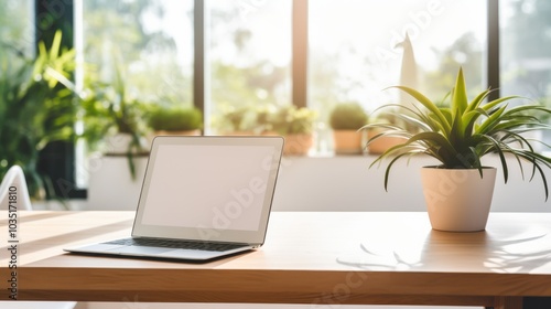 Wallpaper Mural A tablet rests on a sunlit wooden desk surrounded by lush green plants, creating a bright, modern workspace atmosphere. Torontodigital.ca