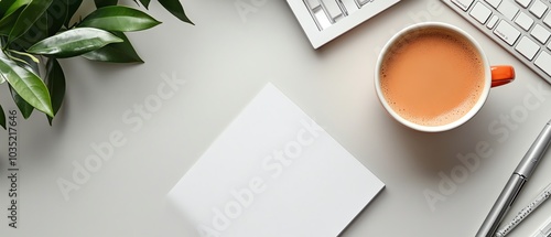 Inviting flat lay composition of an office desk with a white table, blank notebook, computer supplies, and a coffee cup, offering ample text space for customization photo