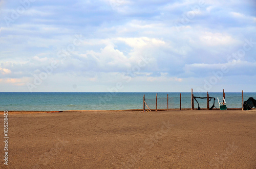 Sunny morning at the beach with sea