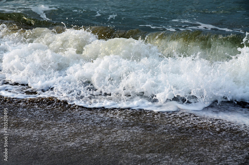 Waves on the beach, sunny day, Italy