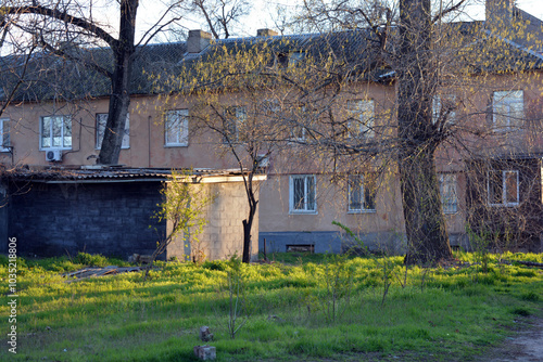 Small, residential area Yuzhny in the city of Dnipro, Dnipropetrovsk, Ukraine. Old, Soviet houses, real estate against the background of a blue sky in summer. photo