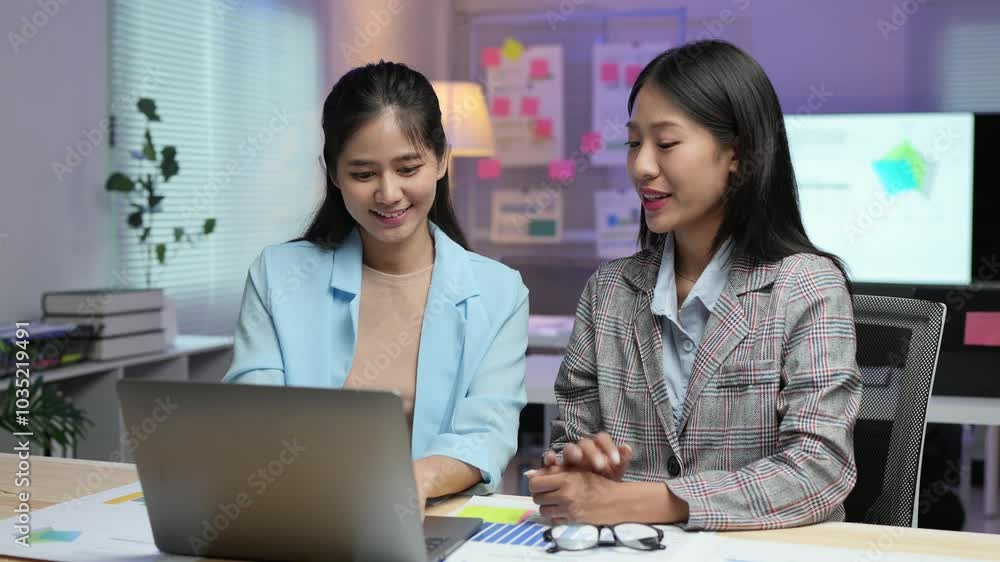 Two businesswomen work together on laptops with financial reports, accounting, online marketing, analysts, business partners working. Analysis and consultant showing investment plans team work concept Two businesswomen work together on laptops with financial reports, accounting, online marketing, analysts, business partners working. Analysis and consultant showing investment plans team work concept