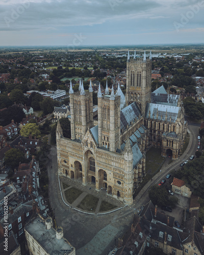 Aerial view of lincoln cathedral surrounded by historic buildings and rooftops, lincoln, united kingdom. photo