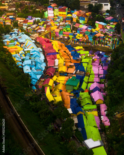 Aerial view of colorful houses and vibrant rooftops in a scenic neighborhood, Blimbing, East Java, Indonesia. photo