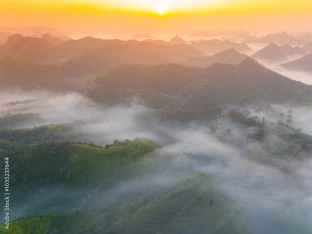 Orange sky and sea of clouds before sunrise. A peaceful, refreshing feeling. View of the hills surrounding Ba Quang, Ha Lang district, Cao Bang province, Vietnam Orange sky and sea of clouds before sunrise. A peaceful, refreshing feeling. View of the hills surrounding Ba Quang, Ha Lang district, Cao Bang province, Vietnam