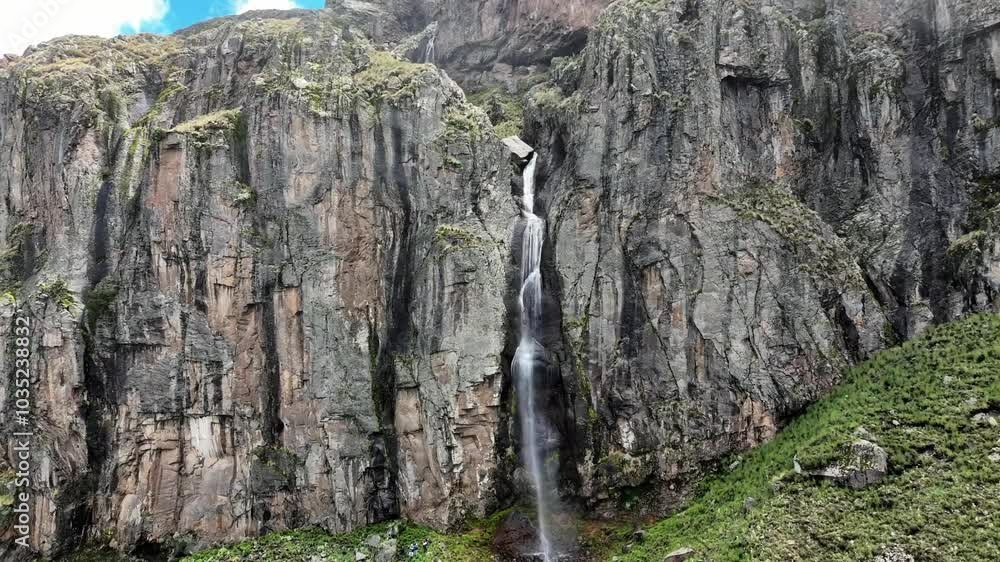 Aerial view of a breathtaking cascading waterfall over rugged cliffs in a lush landscape, Toluca, Mexico. Aerial view of a breathtaking cascading waterfall over rugged cliffs in a lush landscape, Toluca, Mexico.