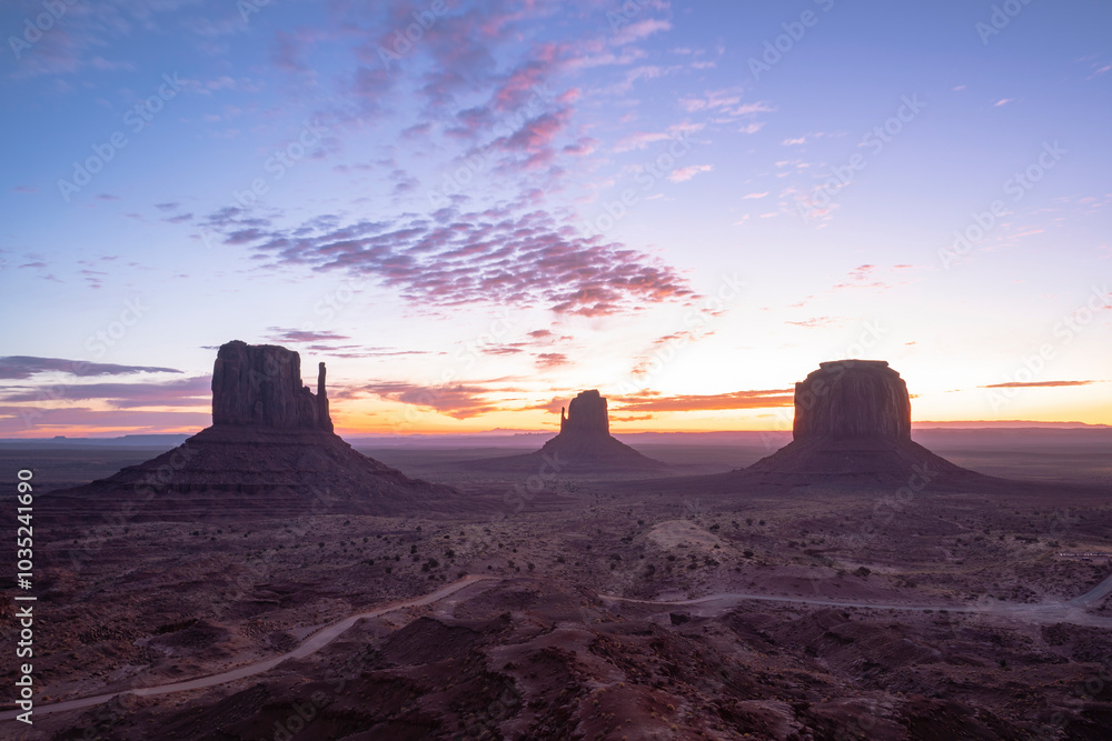 Aerial view of majestic rock formations at sunset in Monument Valley, Arizona, United States. Aerial view of majestic rock formations at sunset in Monument Valley, Arizona, United States.